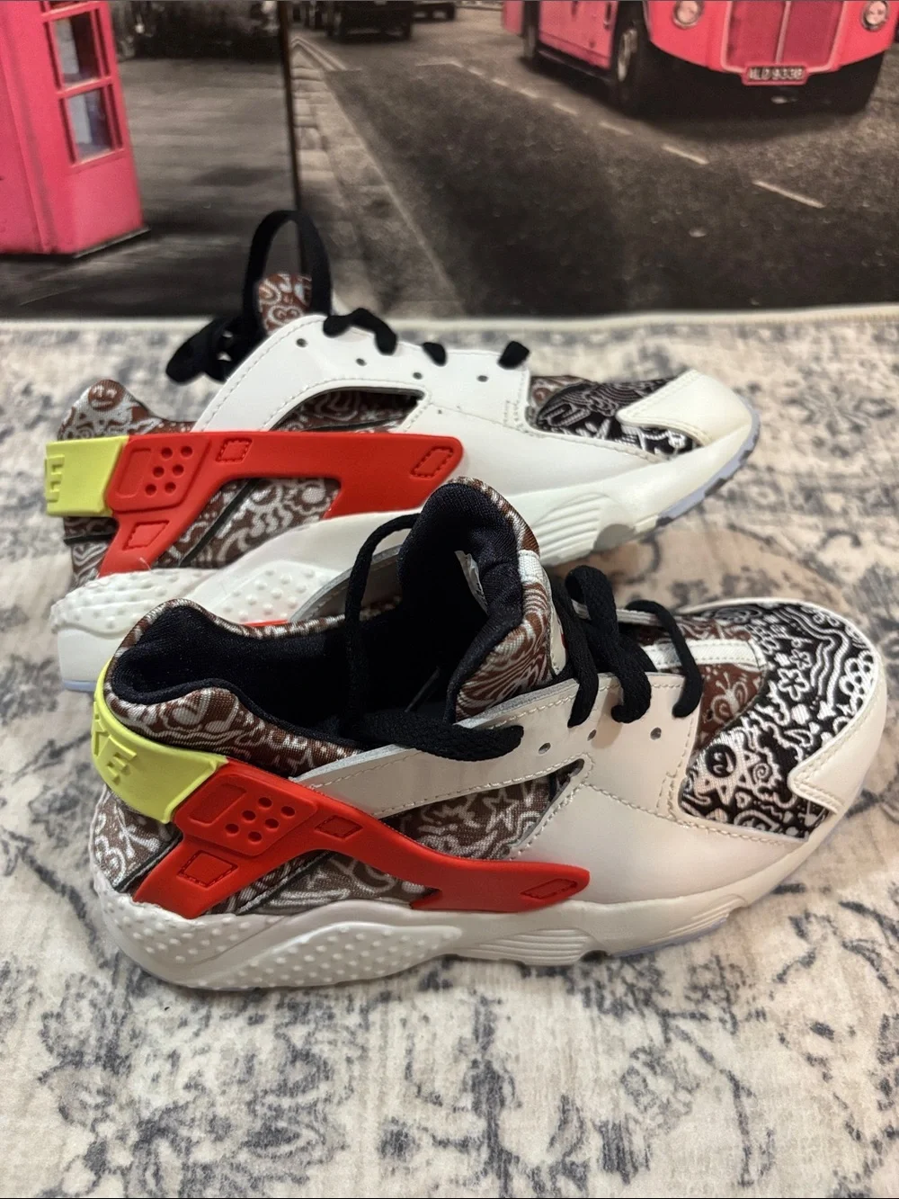 Nike Huarache Kids White Sneakers with Black Pattern, Orange & Yellow Accents